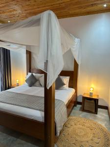 a bedroom with two bunk beds and a rug at Jumba paradise in Mtwapa +26 photos
