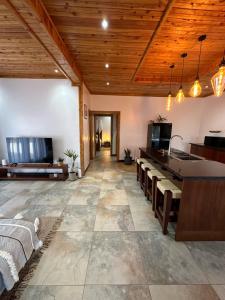 a large living room with a wooden ceiling at Jumba paradise in Mtwapa