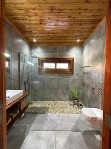 a bathroom with a shower and a sink and a toilet at Jumba paradise in Mtwapa