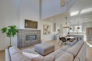 a living room with a couch and a fireplace at Modern Downtown Provo Townhome with Balcony! in Provo