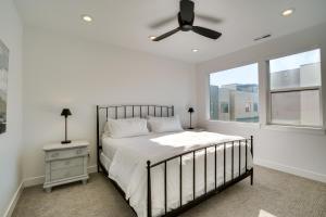 a bedroom with a bed and a ceiling fan at Modern Downtown Provo Townhome with Balcony! in Provo