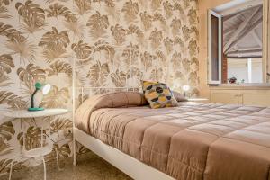 Postel nebo postele na pokoji v ubytování B&B Cumpari Turiddu