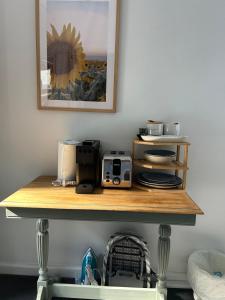 a wooden shelf with a radio on top of it at Rainy Hill Retreat - The Cottage in Cockatoo