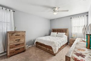 a bedroom with a bed and a ceiling fan at Philadelphia Vacation Rental Near Public Transit! in Philadelphia