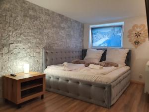 Posteľ alebo postele v izbe v ubytovaní Apartament z jacuzzi Zakopane