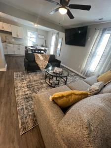 a living room with a couch and a table at The Central Crib in Kansas City