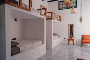 Voodi või voodid majutusasutuse Hostal Pimampiro toas