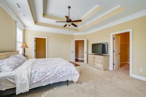 a bedroom with a bed and a ceiling fan at Spacious Kathleen Vacation Rental with Fireplace in Perry