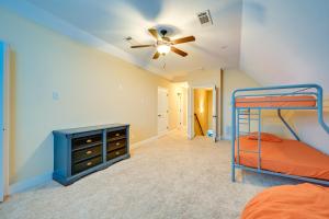a bedroom with a bunk bed and a ceiling fan at Spacious Kathleen Vacation Rental with Fireplace in Perry