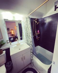 a bathroom with a sink and a shower and a toilet at Seashore Waikiki studio 1 block from a beach No Resort Fees in Honolulu