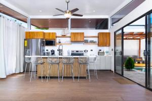 a kitchen with a island with bar stools at Casa Coral - great location - high speed internet in Uvita