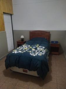 Ένα ή περισσότερα κρεβάτια σε δωμάτιο στο Departamento Central 2 habitaciones