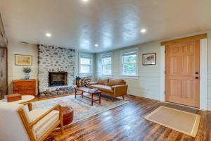 a living room with a couch and a fireplace at Expansive Wilmot Escape with Deck Near Skiing! in Wilmot