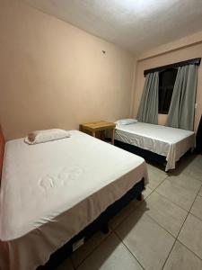 En eller flere senger på et rom på Hotel San Andres