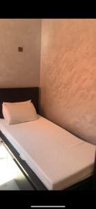 Giường trong phòng chung tại Appartement Laila Marrakech à Tamansot