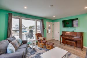 a living room with a couch and a piano at Beach House with Private Pool in North Wildwood in North Wildwood