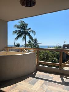 a balcony with a view of the ocean at Mare mío Hotel Boutique in Puerto Arista