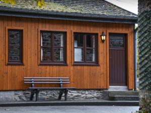 a wooden building with a bench in front of it at Attractive Chalet in Vielsalm with Large Garden in Ennal