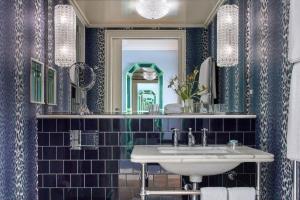a bathroom with a sink and a mirror at Broadwick Soho in London