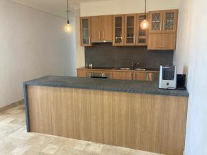 a kitchen with a counter with a microwave on it at LIAPIS ESTATE Rostrevor Adelaide in Adelaide