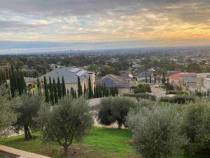 a view of a city with trees and buildings at LIAPIS ESTATE Rostrevor Adelaide in Adelaide