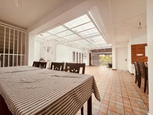 a dining room with a table and chairs at NIRVANA HAVEN HOME STAY in Trivandrum