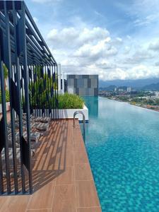 a swimming pool on the roof of a building at The Horizon by Mykey Global in Ipoh
