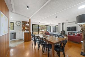 a dining room and living room with a table and chairs at Shangri La - Wifi Included in Inverloch +19 photos