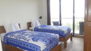 Postel nebo postele na pokoji v ubytování Jukung Dive Resort Bali PENIDA