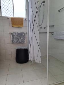 a bathroom with a shower and a sink and a toilet at ON THE WATERS EDGE in Port Lincoln