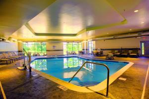 a large swimming pool in a large building at Candlewood Suites - Joliet Southwest, an IHG Hotel in Joliet