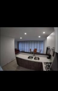a kitchen with a sink and a counter top at Hermoso y tranquilo apartasuite in Floridablanca