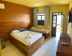 Giường trong phòng chung tại Águas de Sauípe