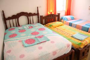 מיטה או מיטות בחדר ב-POSADA NATIVA SAN GABRIEL 1 Y 2