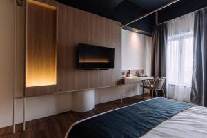 Postel nebo postele na pokoji v ubytování Impiana by Roxy Hotel
