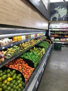 a produce section of a store with fruits and vegetables at Apartaestudio privado con aire cerca Aeropuerto in Cali