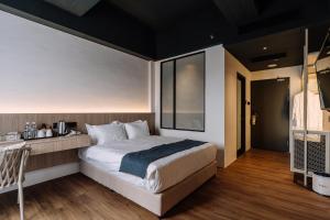 Postel nebo postele na pokoji v ubytování Impiana by Roxy Hotel