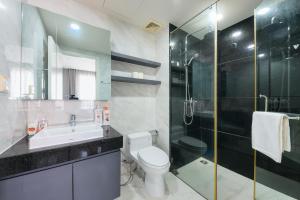 a bathroom with a toilet and a sink and a shower at Elysium CBD Rivergate Apartment - Gym & Pool - Free 4G sim for 3 nights in Ho Chi Minh City