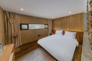 Hangzhou XianQingShan Homestay Westlake客房内的一张或多张床位