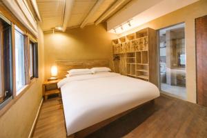 Hangzhou XianQingShan Homestay Westlake客房内的一张或多张床位