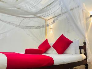 A bed or beds in a room at Cinnamon City