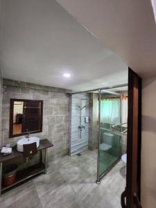 a bathroom with a sink and a shower at Uptown Eco Hotel in Kuala Terengganu