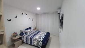 Postel nebo postele na pokoji v ubytování Apartamento en Ricaurte para descansar y disfrutar