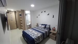 Postel nebo postele na pokoji v ubytování Apartamento en Ricaurte para descansar y disfrutar