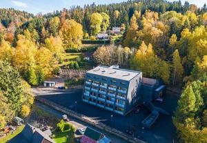 an aerial view of a building in the middle of a forest at Apartmán víla Amálka in Janov nad Nisou