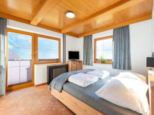 a bedroom with a bed with two pillows at great apartment near the ski area in Hippach