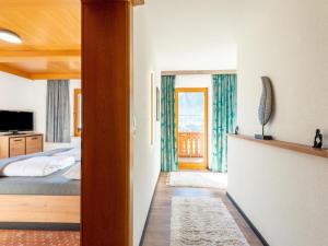 a bedroom with a bed and a window at great apartment near the ski area in Hippach