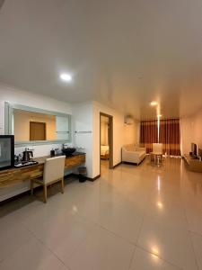 a large living room with a table and chairs at PUNTA CLARK HOTEL in Clark