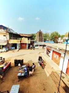 a group of people sitting in chairs in a market at Hostel shivshakti khajuraho in Khajurāho