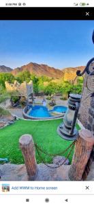a picture of a home garden with a pool at Fort Mughaibar Resort in Hatta
